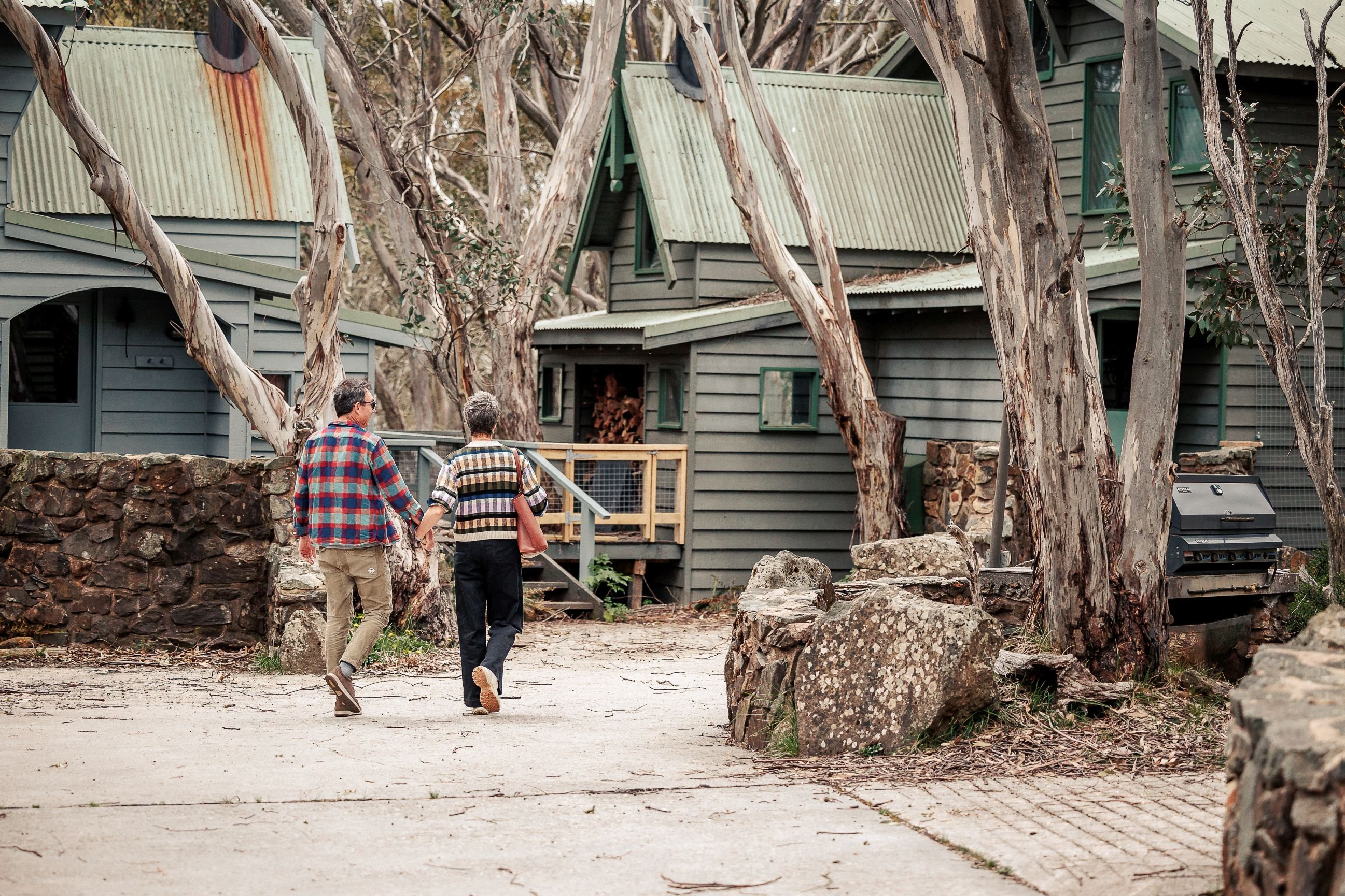 Couple walking through Dinner Plain alpine village