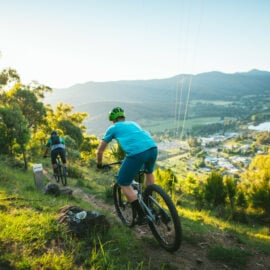 Two cyclists riding along singletrack at Big Hill Mountain Bike Park