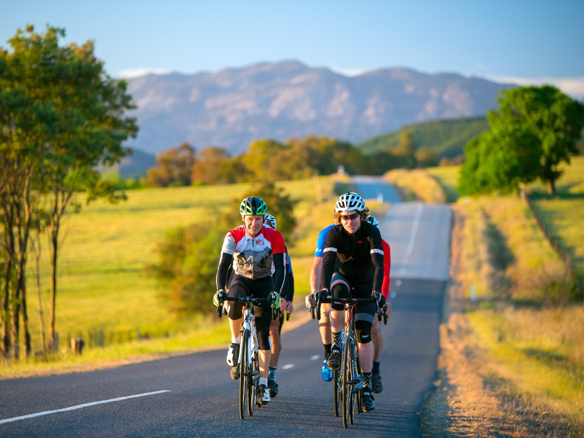 Cycling along Carrolls Road with Mt Buffalo in the background