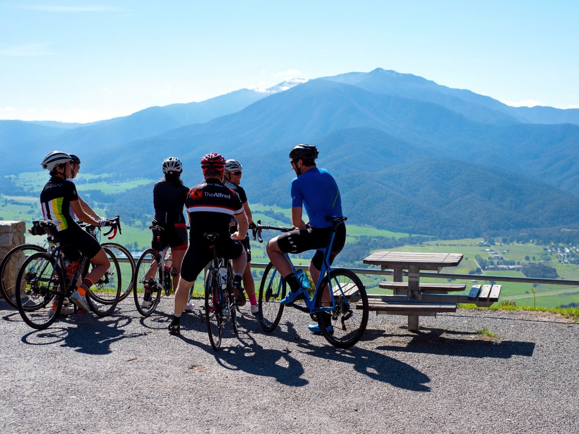 Cyclist take a break at Sullivan's Lookout on the ride from Bright to Falls Creek